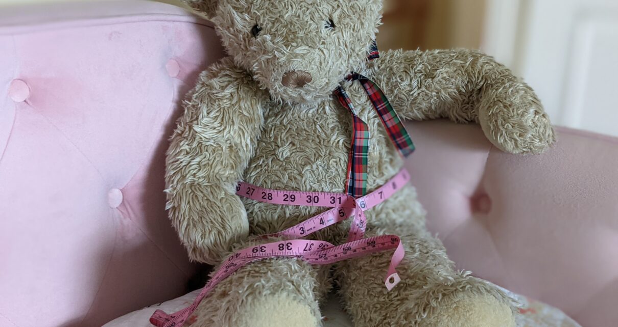 bear with soft measuring tape for body fat